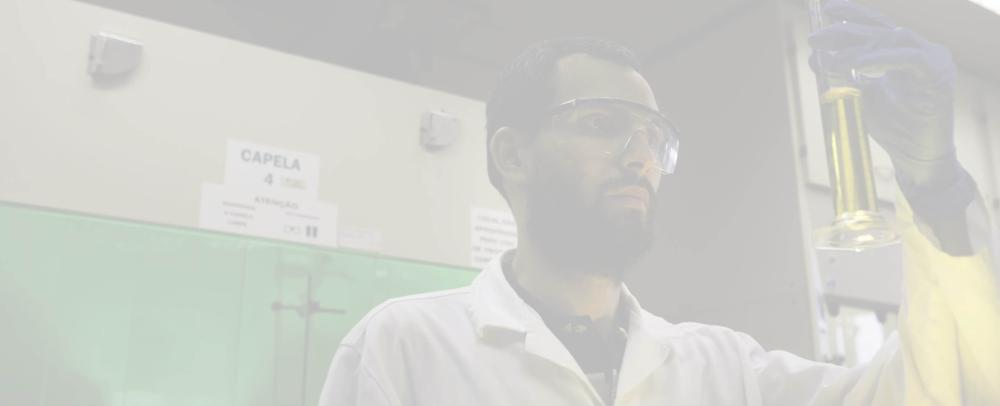 Scientist observing a liquid in a laboratory at Cenpes, the Petrobras Research Center.