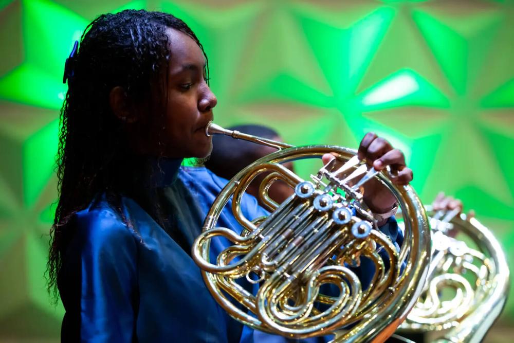 Young person playing a wind instrument